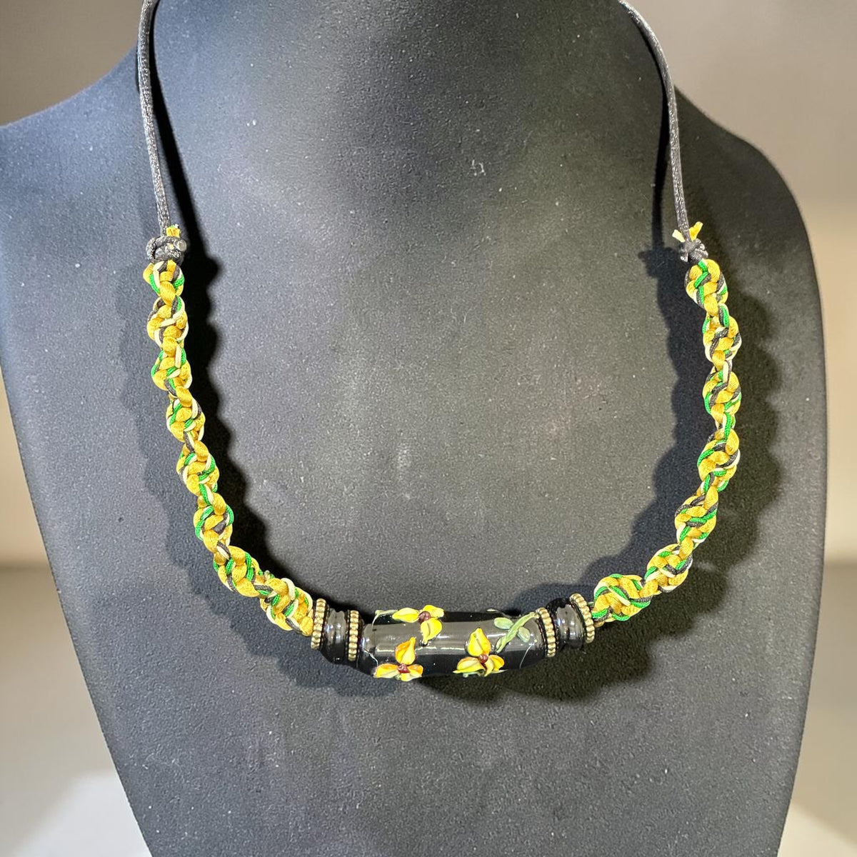 Goldfinch | Lampwork Glass Flower Necklace on Gold & Green Spiral Cord
