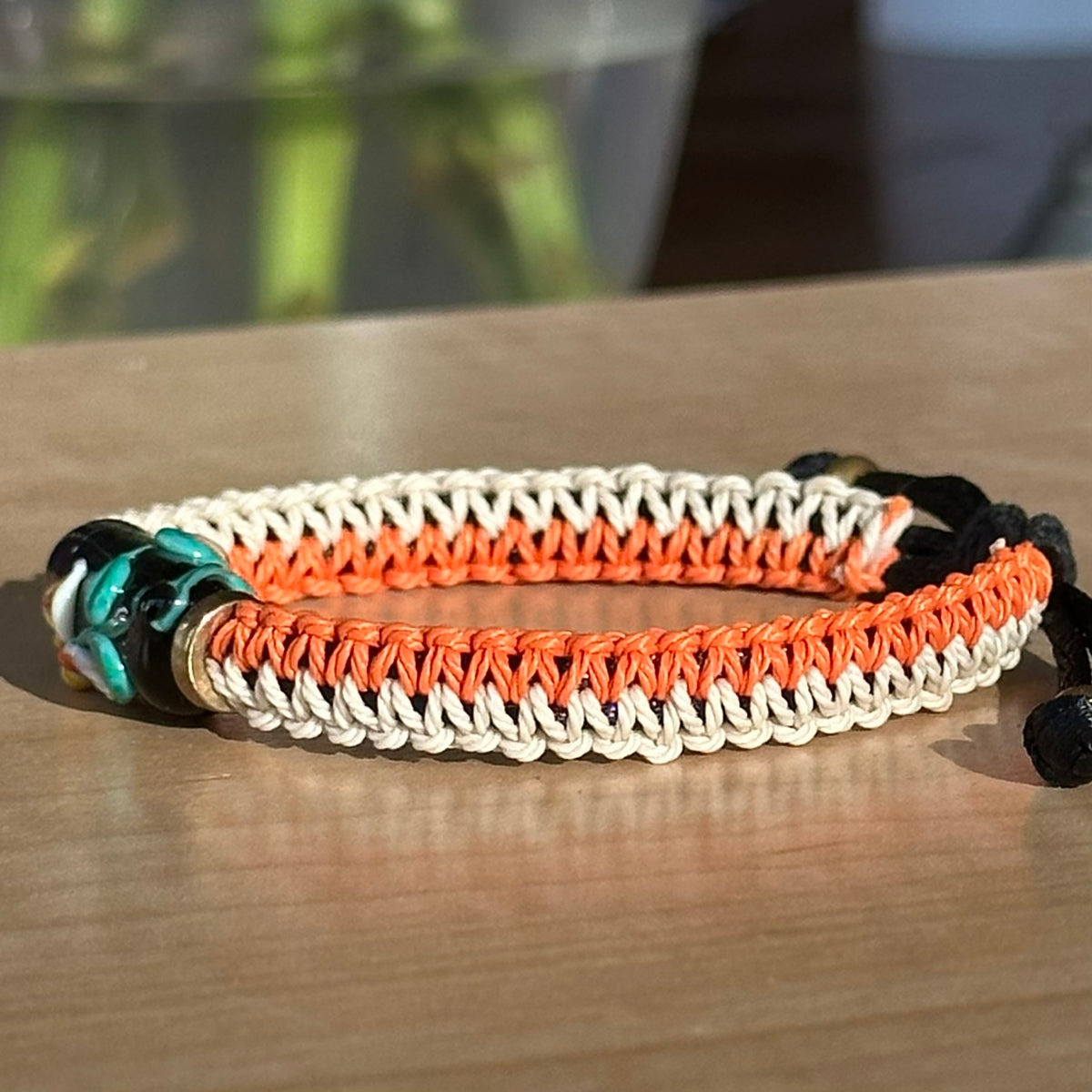 Persimmon Night | Lampwork Glass Flower Bracelet on Orange & Cream Woven Cotton Cord