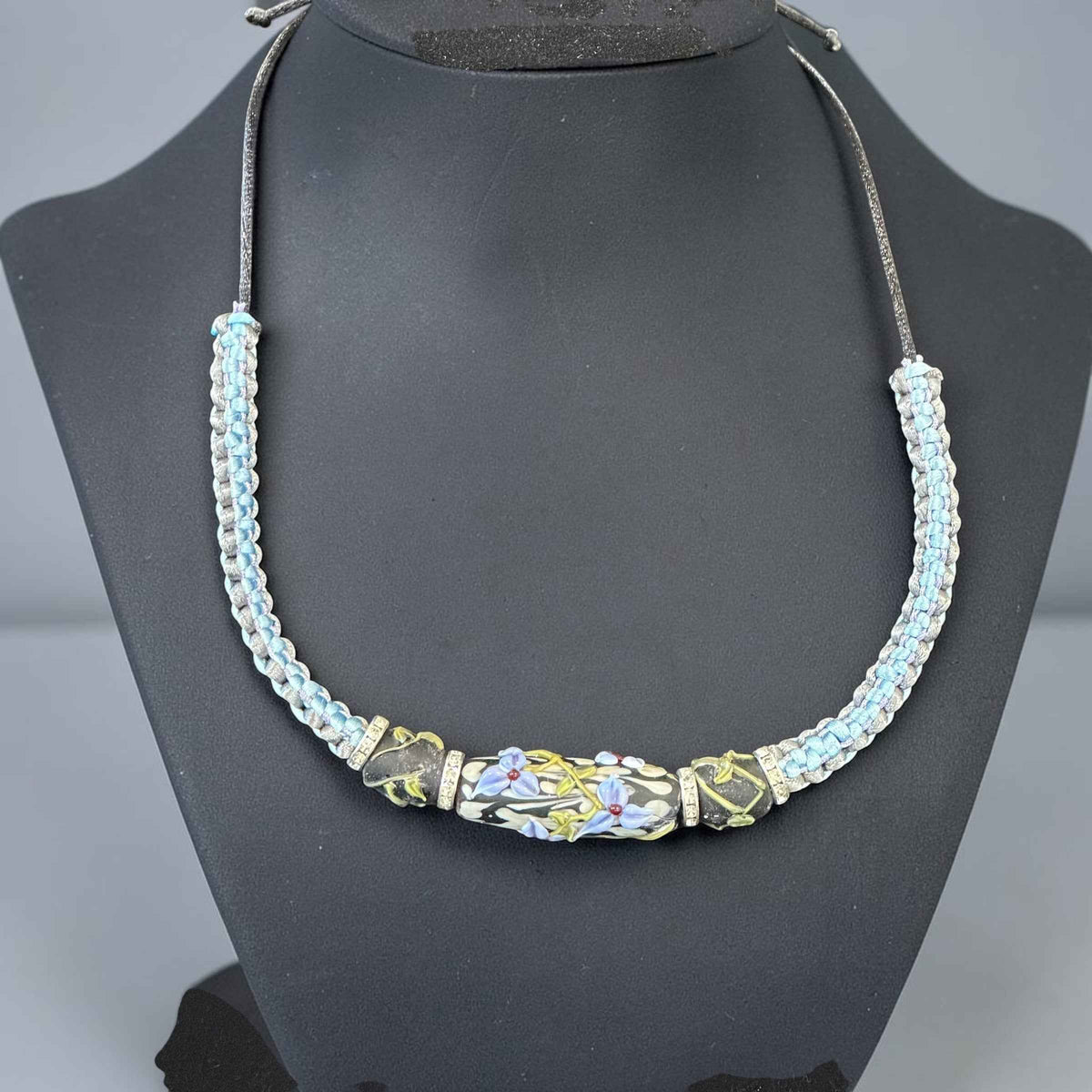 Silver Lining | Three-Bead Lampwork Glass Flower Necklace on Ice Blue & Grey Braided Cord