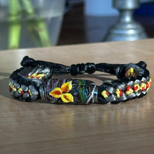 Cinder Marigold | Lampwork Glass Flower Bracelet on Black, Gray, Yellow & Red Braided Cord