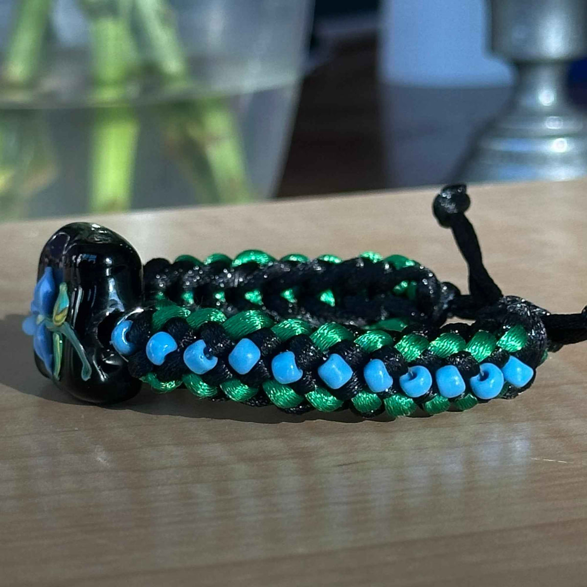 Wildwood Blue | Lampwork Glass Flower Bracelet on Emerald Green & Black Braided Cord