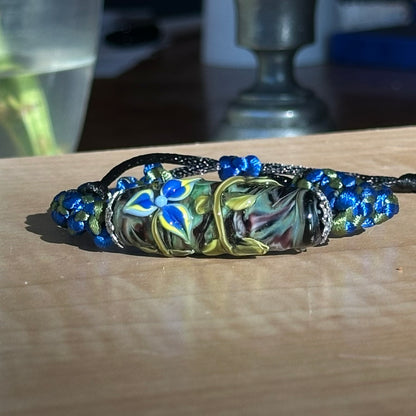 Larkspur Dusk | Lampwork Glass Flower Bracelet on Royal Blue & Olive Braided Cord