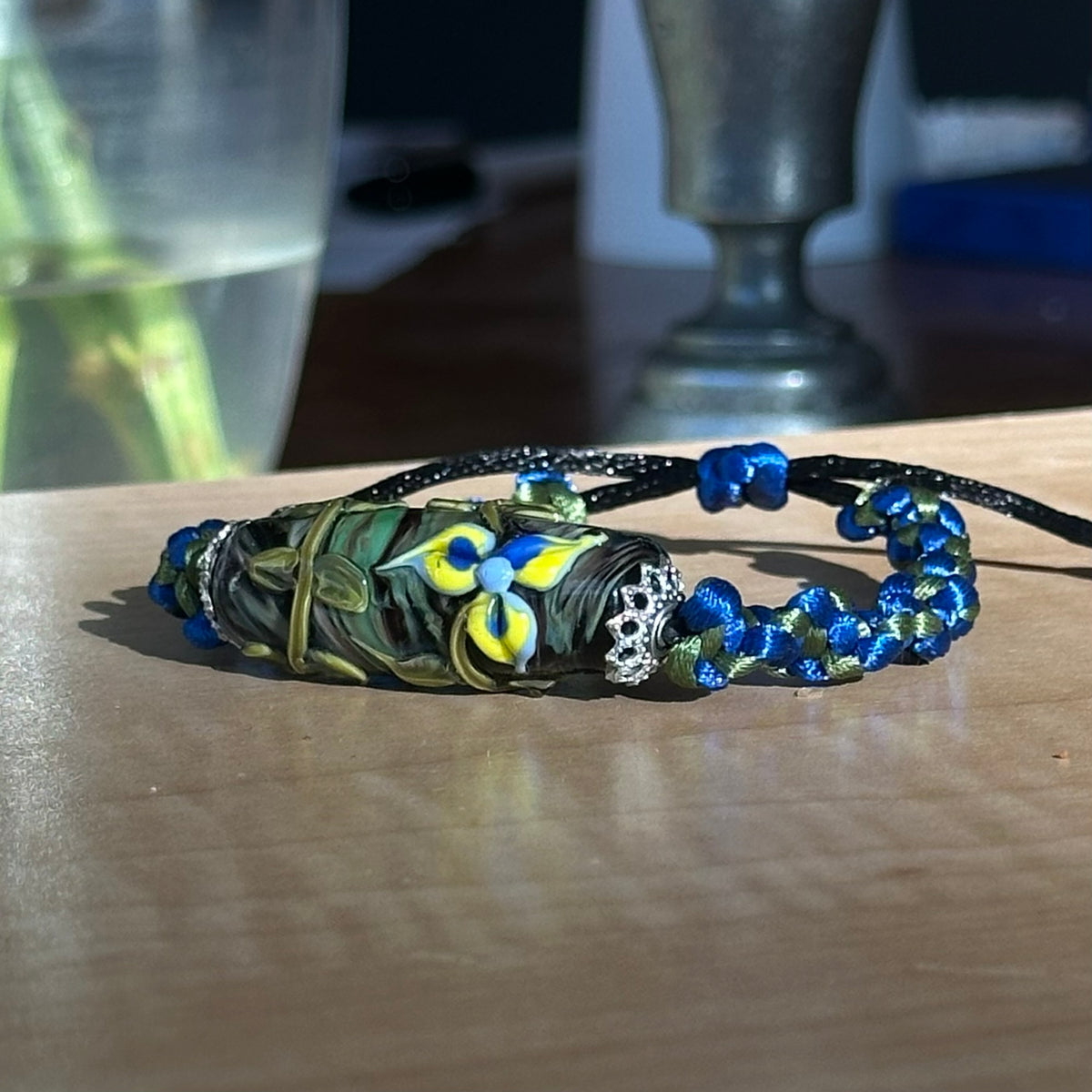 Larkspur Dusk | Lampwork Glass Flower Bracelet on Royal Blue & Olive Braided Cord