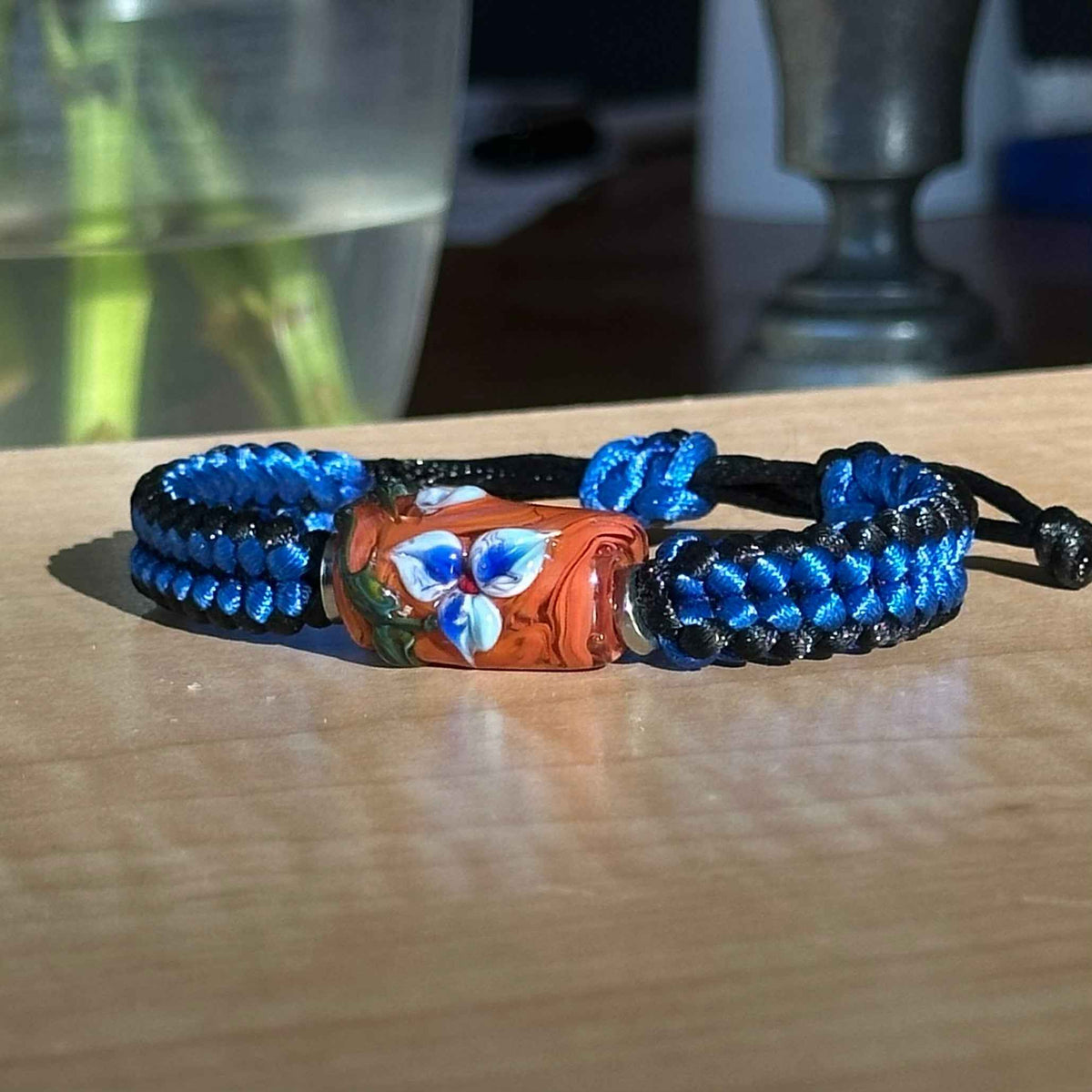 Bluebell Rust | Lampwork Glass Flower Bracelet on Royal Blue & Black Braided Cord