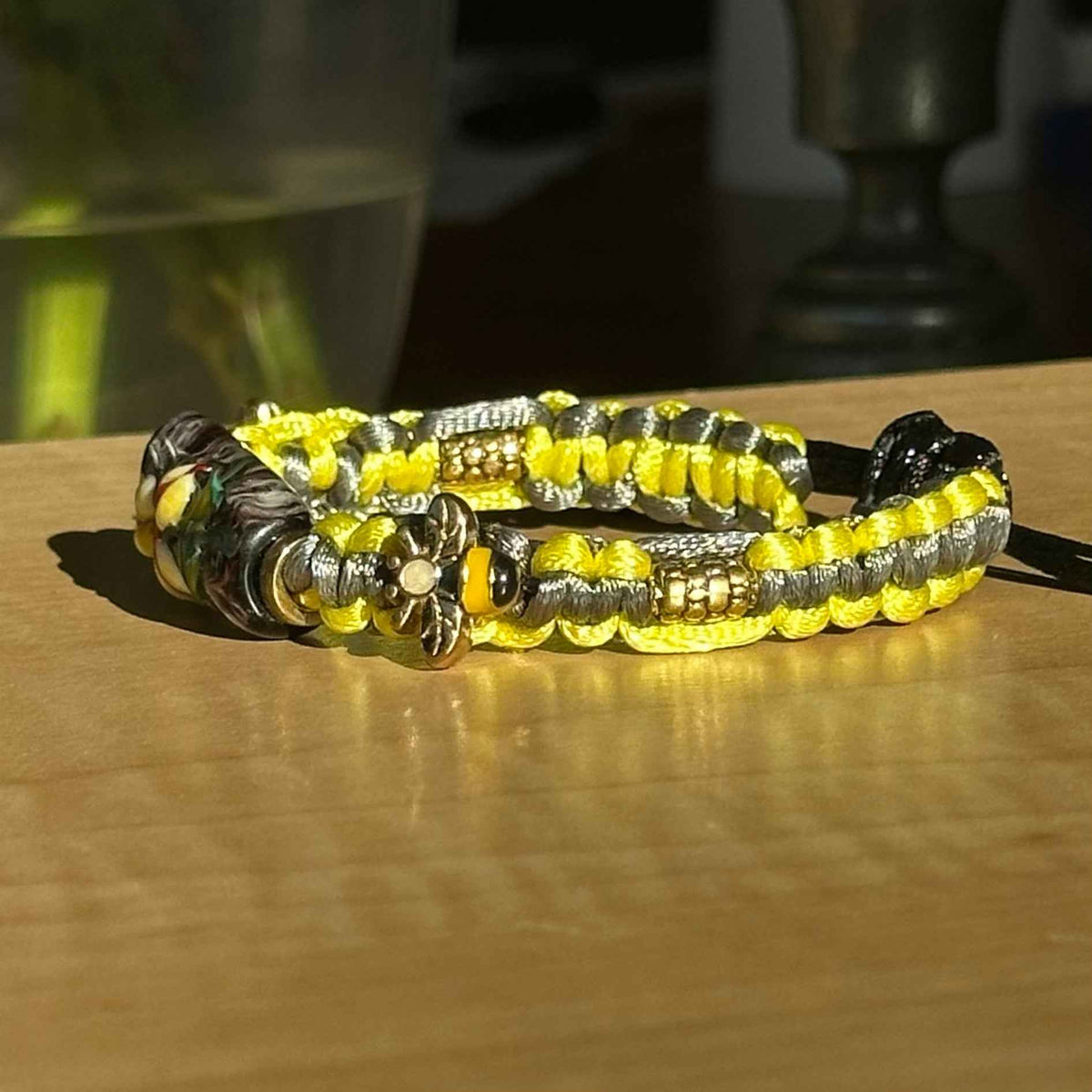 Buttercup Slate | Lampwork Glass Flower Bracelet with Flower Charms on Lime Yellow & Gray Braided Cord