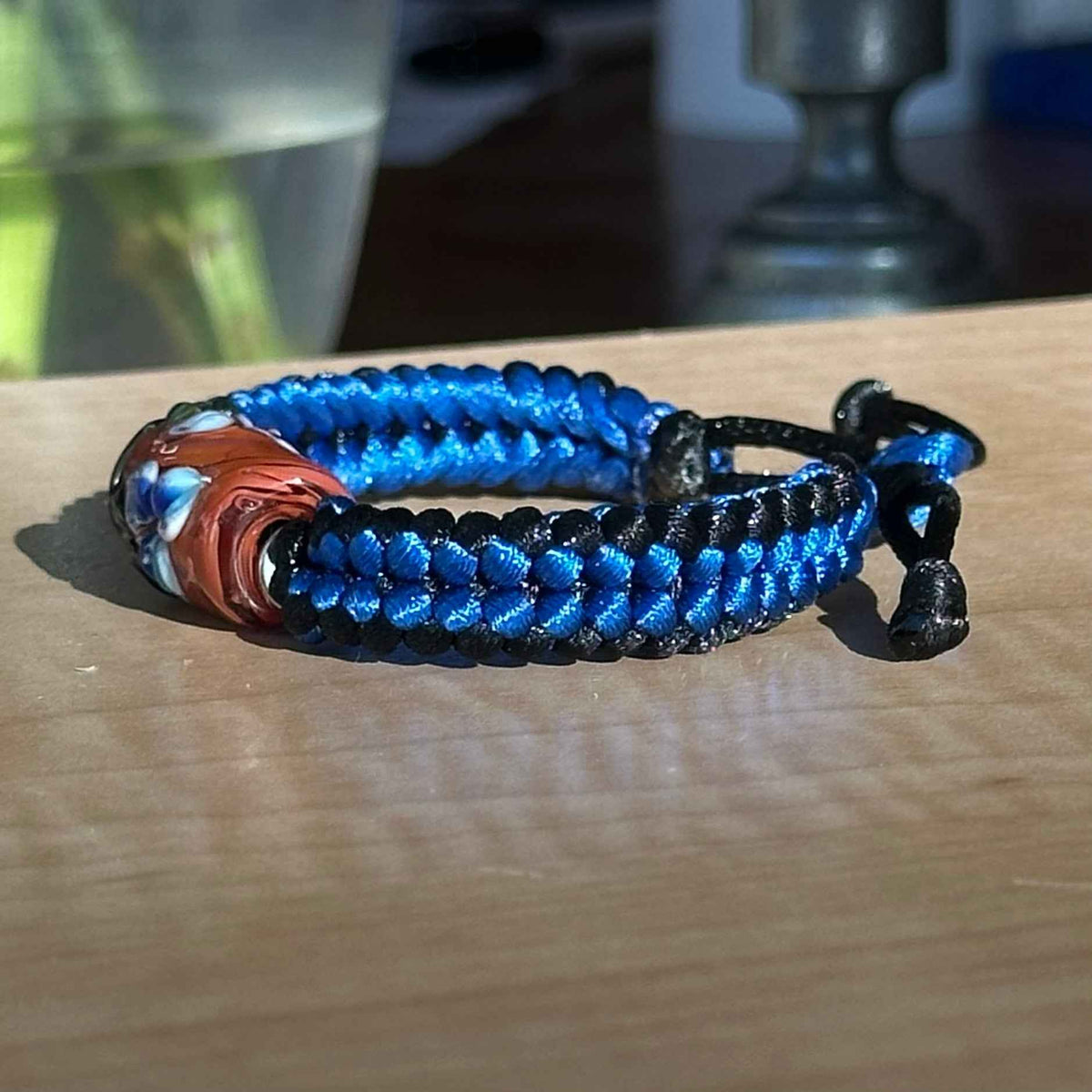 Bluebell Rust | Lampwork Glass Flower Bracelet on Royal Blue & Black Braided Cord