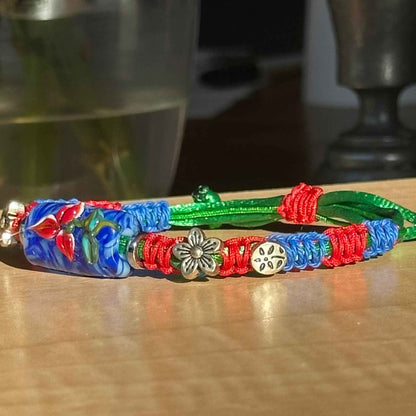 Cobalt Poppy | Lampwork Glass Flower Bracelet with Flower Charms on Red, Blue & Green Braided Cord