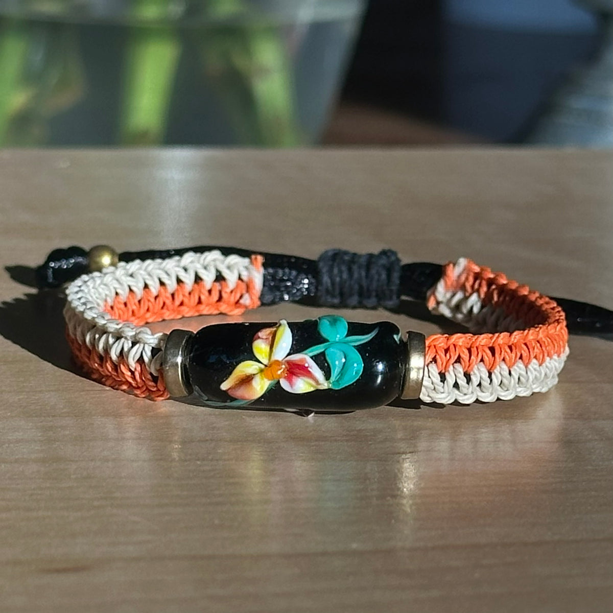 Persimmon Night | Lampwork Glass Flower Bracelet on Orange & Cream Woven Cotton Cord