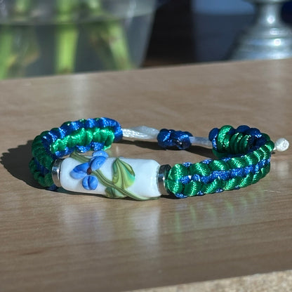 Bluebonnet Glade | Lampwork Glass Flower Bracelet on Emerald Green & Royal Blue Braided Cord