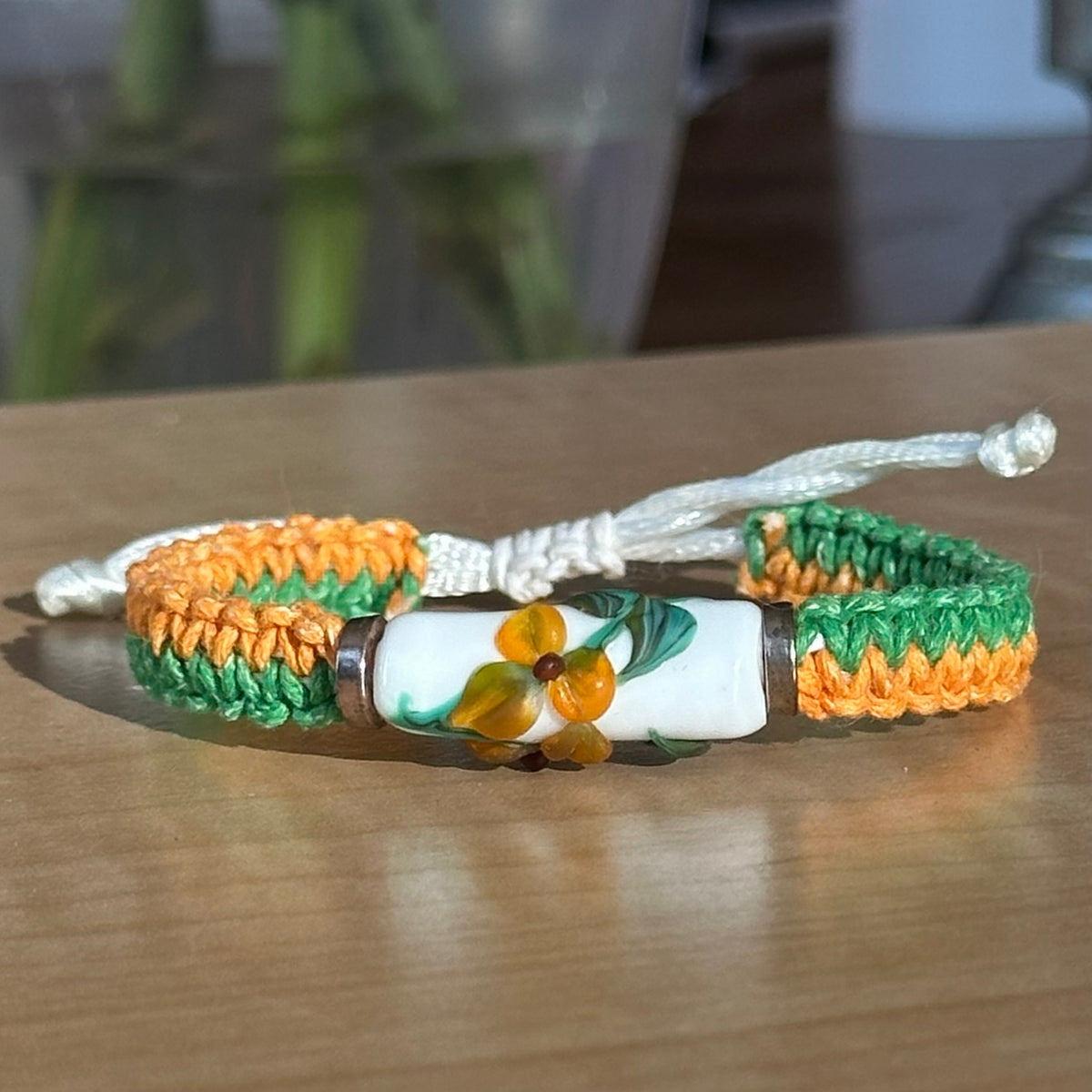 Marigold Meadow | Lampwork Glass Flower Bracelet on Orange & Green Woven Cotton Cord
